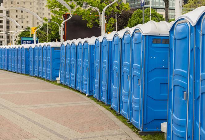 a row of sleek and modern portable restrooms at a special outdoor event in Stickney